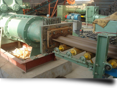Machine for extruding clay roof tiles